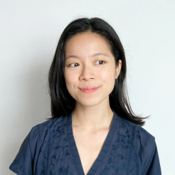 Portrait of Rachel Teo, smiling, in a navy top.