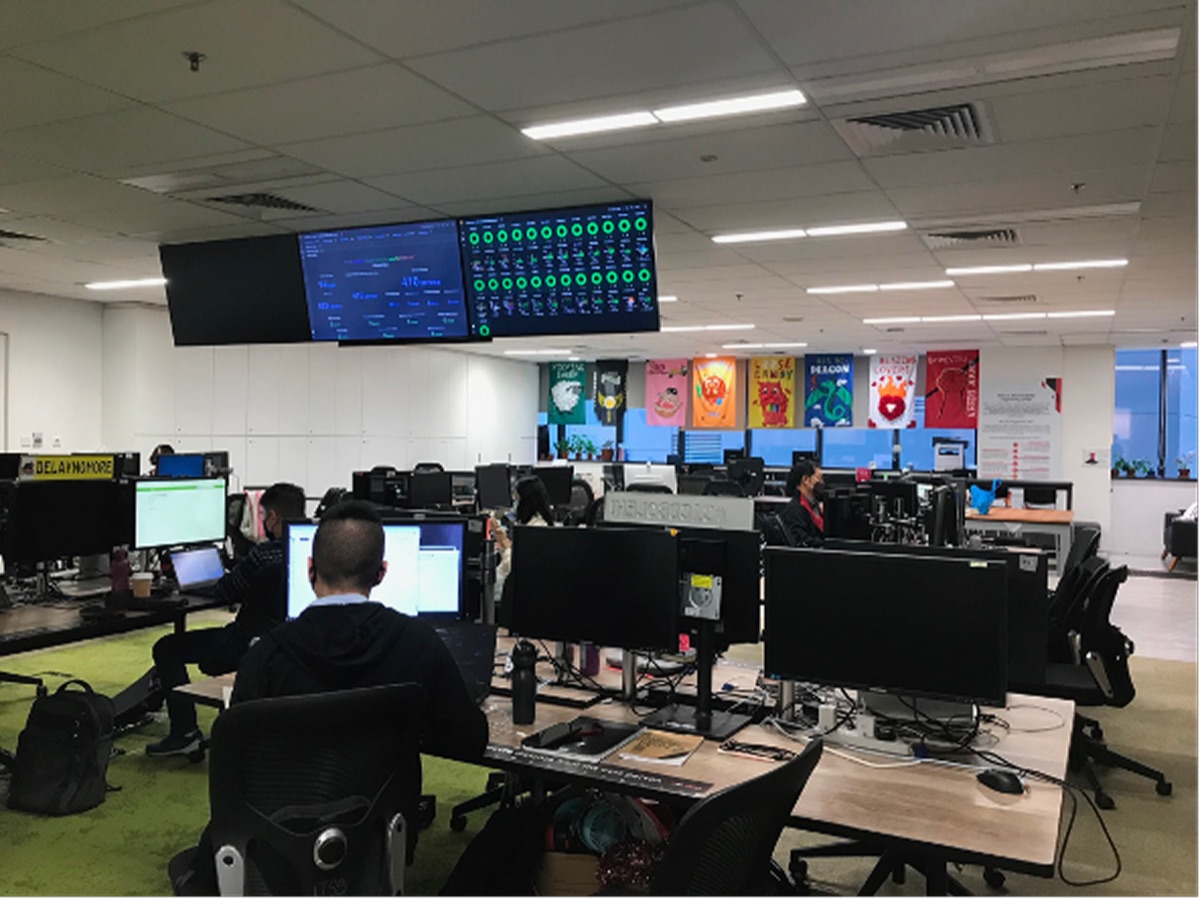 The engineers’ open-plan office, with monitoring dashboards on large screens.